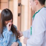 Doctor listening to a teen's concerns at motherhood hospital